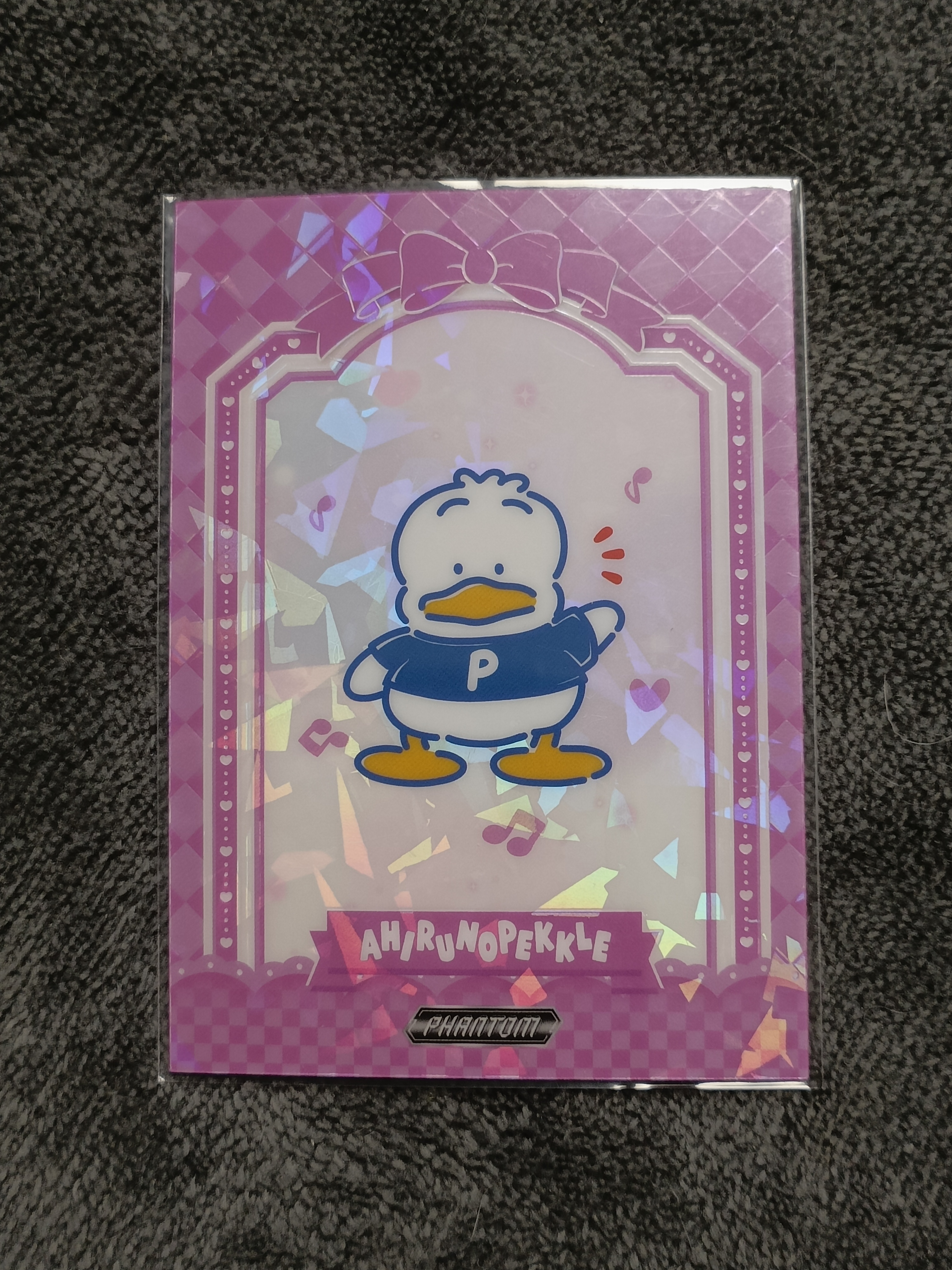 2023 Kakawow PHANTOM 三丽鸥家族系列收藏卡 AHIRUNOPELLE 贝克鸭 【谦谦拍卖】PSA-IPU-12 紫折 024/115编 秋鹿